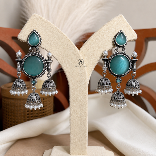 Aqua Blue Monalisa Tripuri Jhumkas handcrafted in oxidised brass with pearl and intricate traditional detailing.
