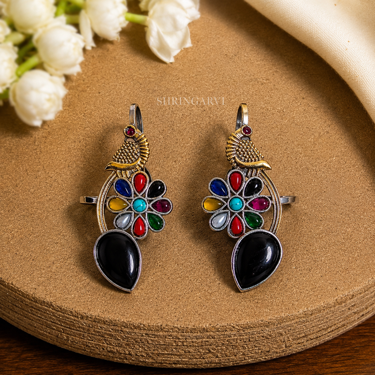 Black Multicolour Meenakshi dual tone brass earcuffs with black stone, multicolour floral stones, and peacock motif by Shringarvi.