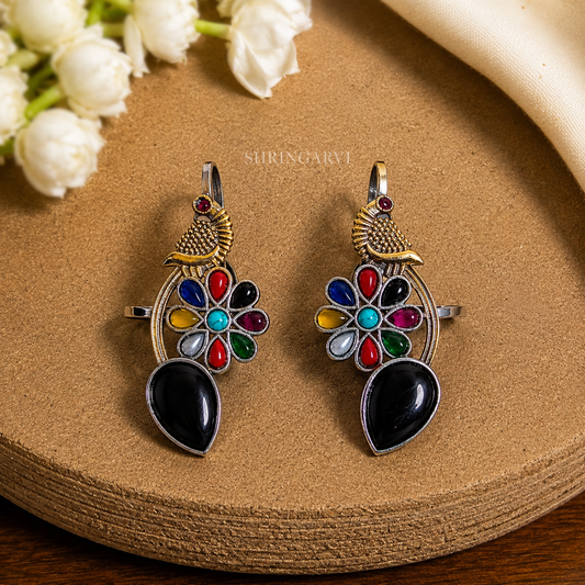 Black Multicolour Meenakshi dual tone brass earcuffs with black stone, multicolour floral stones, and peacock motif by Shringarvi.