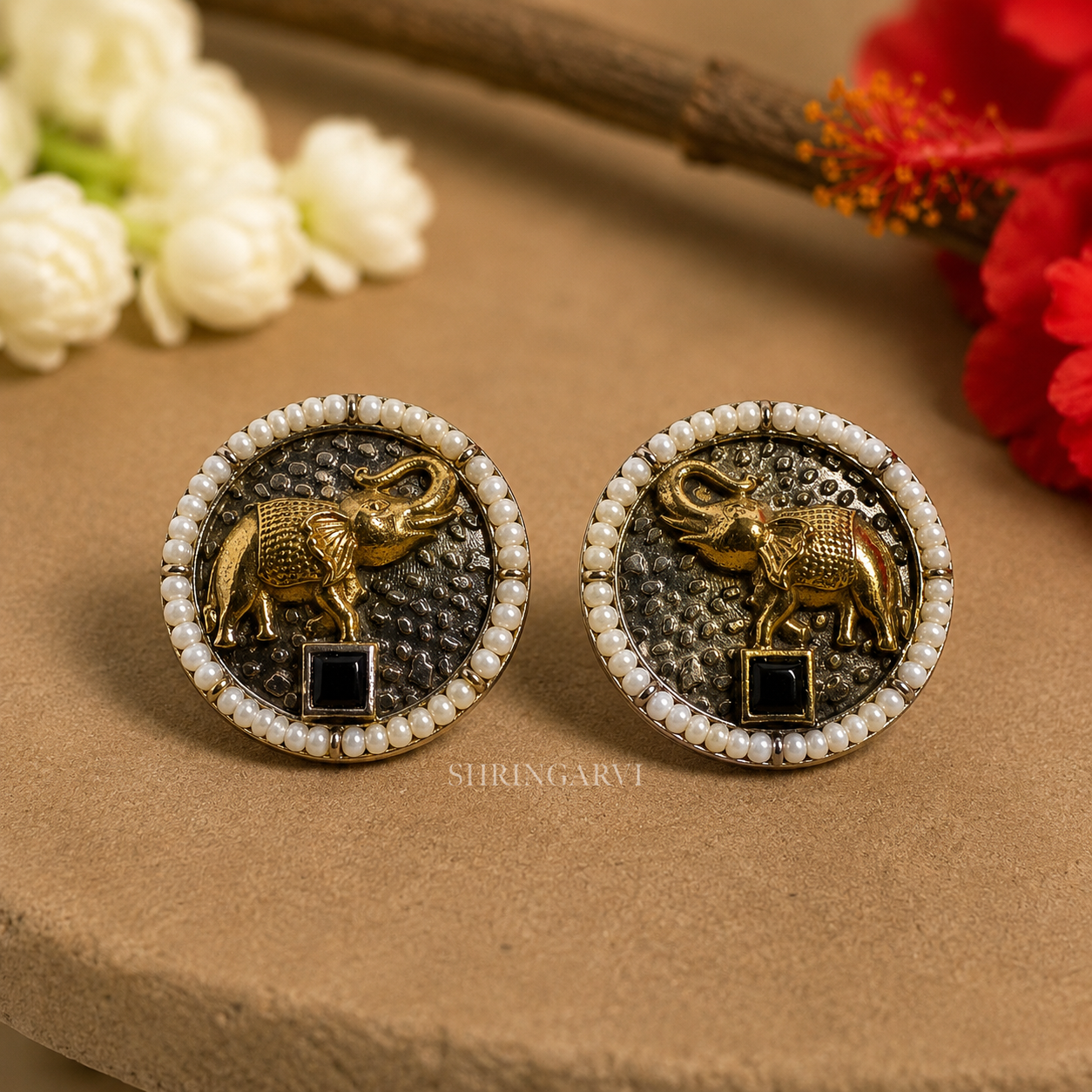 Oxidised brass Black Vinayak studs with antique gold elephant motif, black stone and pearl border by Shringarvi