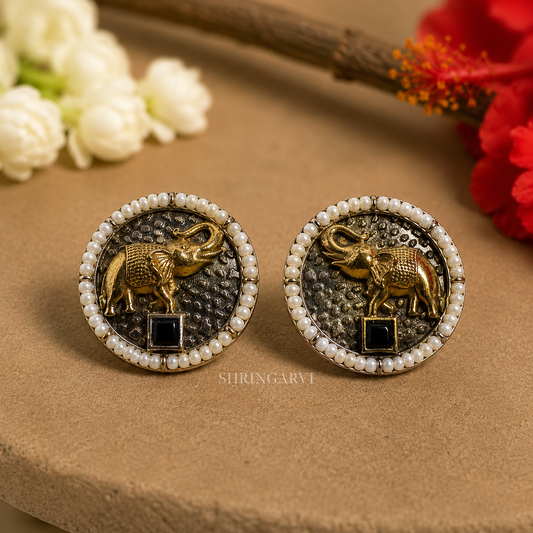 Oxidised brass Black Vinayak studs with antique gold elephant motif, black stone and pearl border by Shringarvi