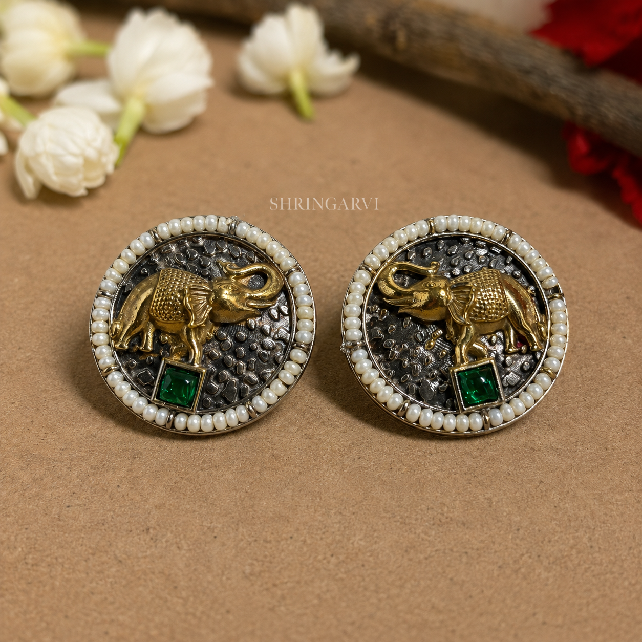 Oxidised brass Emerald Vinayak studs with antique gold elephant motif, emerald stone and pearl border by Shringarvi