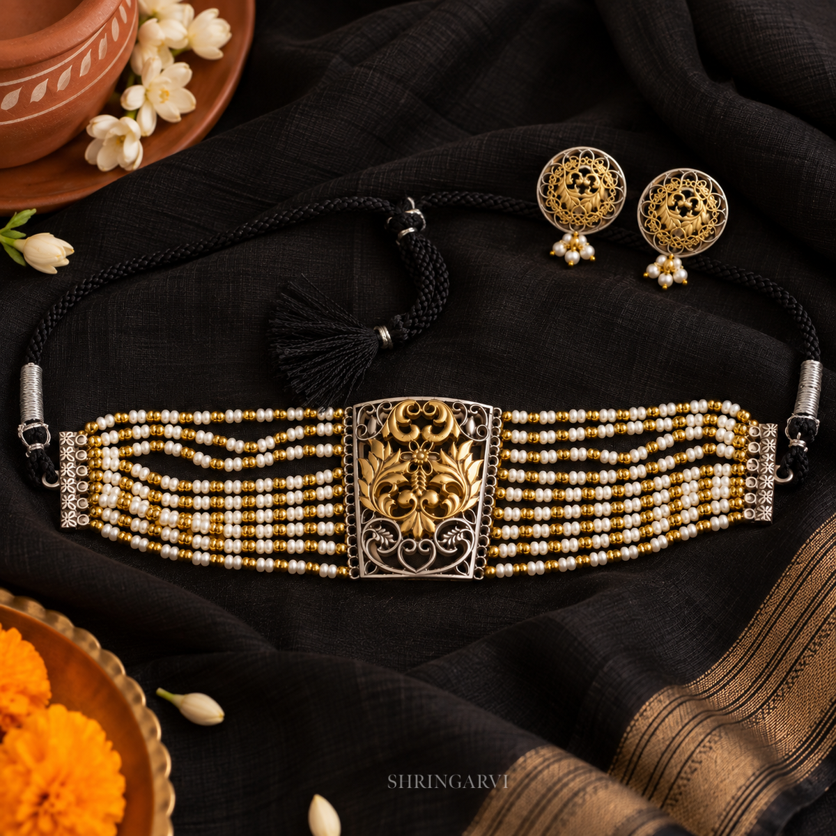 Gauri Dual Tone Pearl Choker Set with oxidised silver and gold-tone floral centerpiece, pearl bead strands, adjustable black dori closure, and matching pearl drop stud earrings