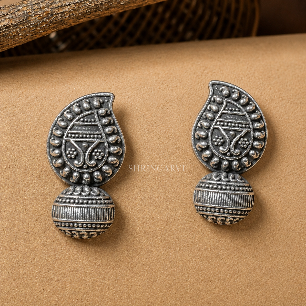 Kairi Studs in oxidised brass featuring a traditional mango-shaped (kairi) motif with intricate handcrafted detailing