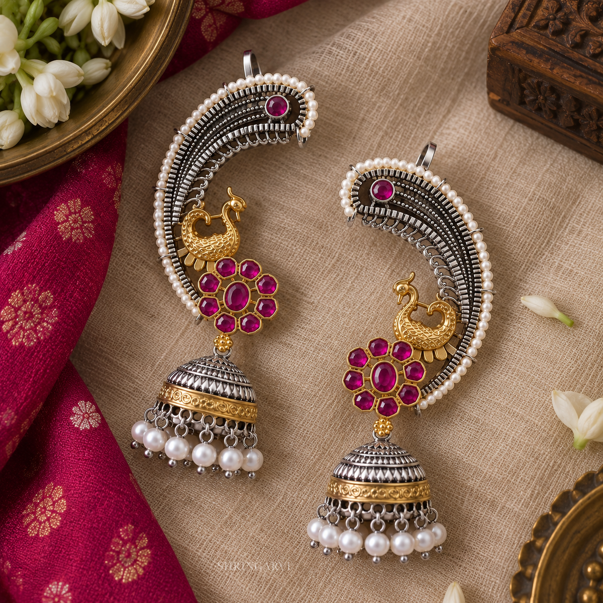 Magenta Rajnigandha dual tone peacock earcuffs with magenta stones, pearl detailing and jhumka drop for festive and wedding wear.