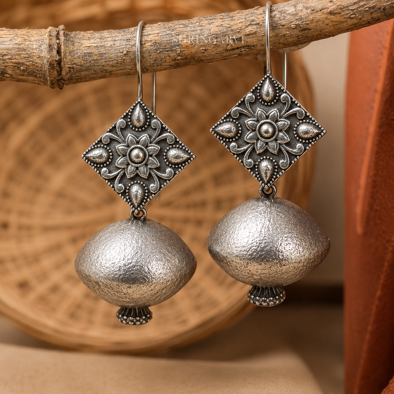 Matki Danglers oxidised silver earrings with pot-shaped design and handcrafted floral detailing.