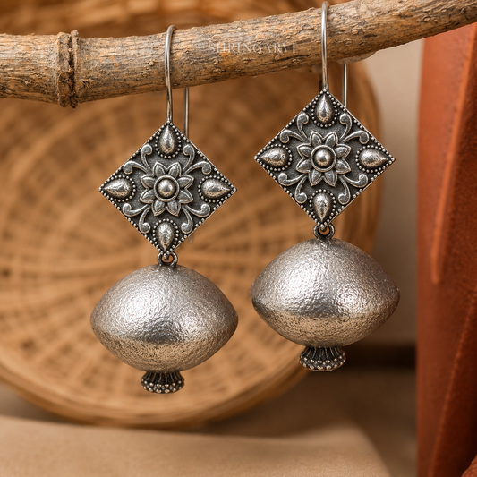 Matki Danglers oxidised silver earrings with pot-shaped design and handcrafted floral detailing.