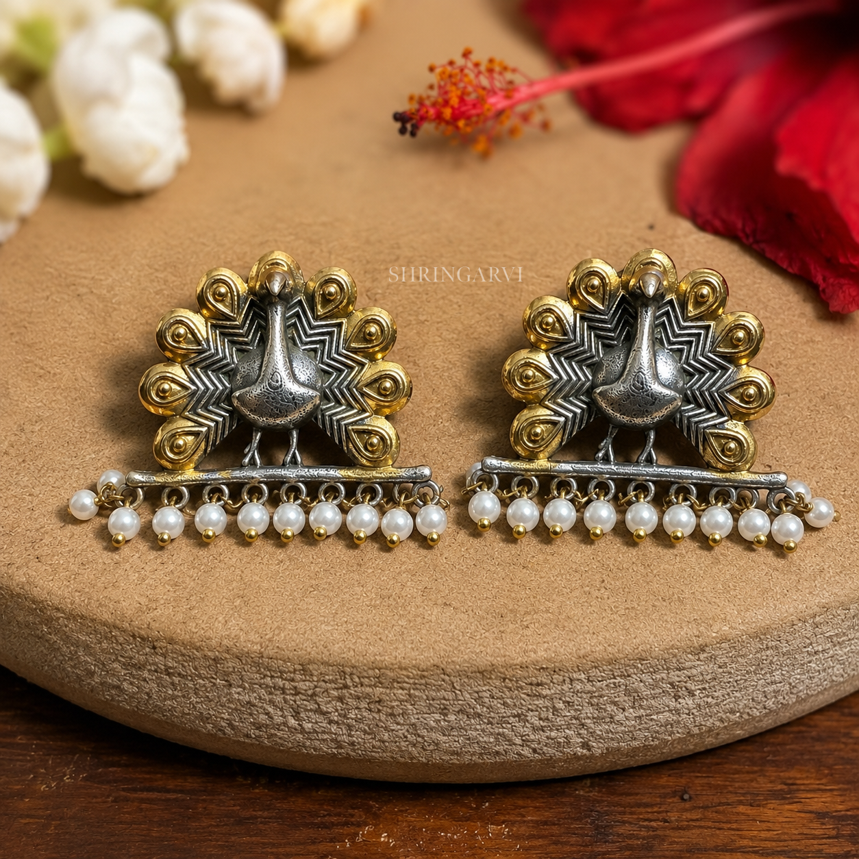 Dual-tone oxidised brass Mayuri studs with peacock motif and pearl drops by Shringarvi