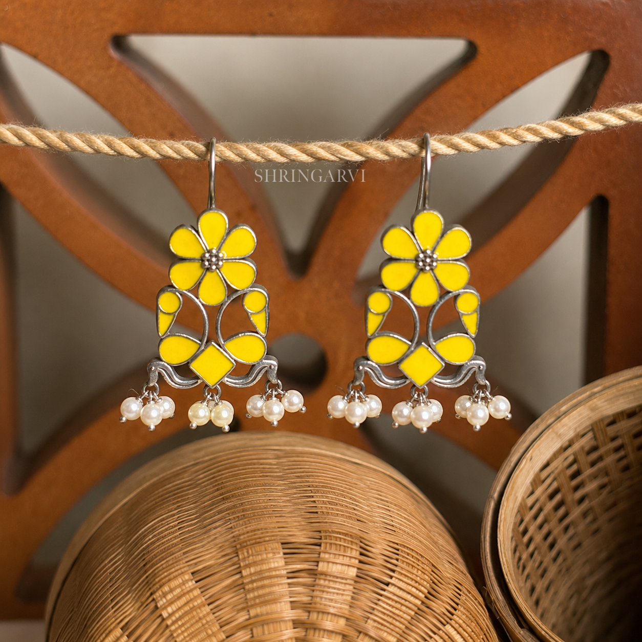 Handcrafted oxidised brass Meenakari Morni danglers featuring Yellow enamel detailing with pearl cluster drops for festive and ethnic wear.