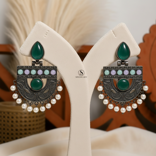 Multicolour Aadya Chandbalis handcrafted in oxidised brass featuring mint green monalisa stones, pastel accents, intricate traditional detailing, and pearl drops for festive and ethnic wear.