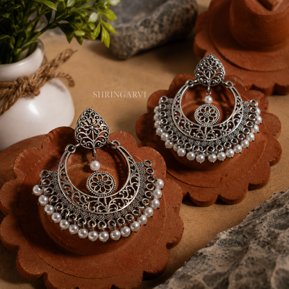 Pearl Meera Chandbali oxidised silver chandbali earrings with floral filigree design and pearl drop detailing.